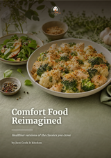 A styled food photography scene showing a bowl of creamy broccoli and cauliflower comfort food topped with breadcrumbs, alongside a salad and small bowls on a muted green surface. Large text reads 'Comfort Food Reimagined' with smaller text 'by Just Cook It kitchen'.
