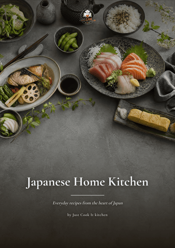 A book cover titled 'Japanese Home Kitchen' with the subtitle 'Everyday recipes from the heart of Japan' by Just Cook It Kitchen. The top portion shows an overhead styled food scene with Japanese dishes on a dark gray surface, including sashimi, rice, edamame, soy sauce, and grilled fish.
