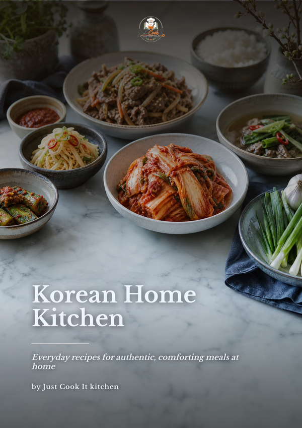 A cookbook cover titled 'Korean Home Kitchen' with a photograph of several Korean dishes arranged on a marble surface, including kimchi, noodles, rice, and green onions. The Just Cook It kitchen logo appears at the top.