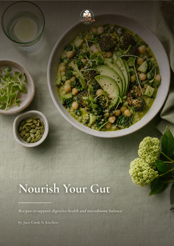 A styled food photography layout featuring a bowl of green chickpea and broccoli soup with avocado slices, accompanied by small bowls of garnish and seeds on a muted green tablecloth. Text at the bottom reads 'Nourish Your Gut' with smaller subtitle and creator credit 'Just Cook It kitchen'.