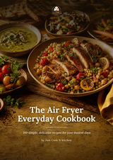 The front cover of the cookbook 'The Air Fryer Everyday Cookbook' by Just Cook It kitchen, featuring a warm, appetizing photograph of a cooked chicken salad with chickpeas, tomatoes, and lemon on a rustic wooden table.